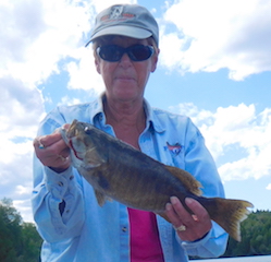 Big Smallmouth Bass are a Blast by Sue Fishing at Fireside Lodge in Canada